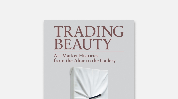 Book cover with a nail hammered into a loose fabric on a canvas.