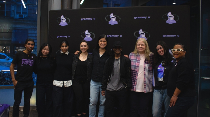 Group photo of panelists and staff at the event