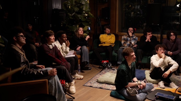 Photo of students sat in a studio