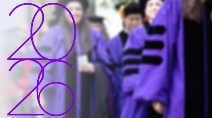 2026 over students walking in commencement robes