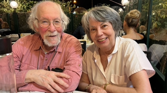 James and Anna sit at a table together