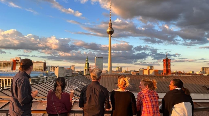 People look out over a skyline