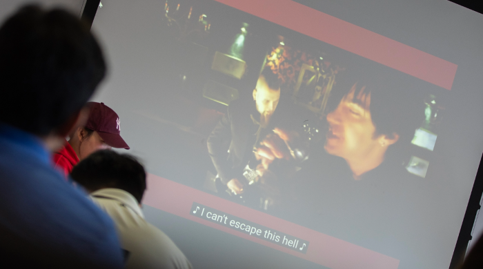Music video plays on a screen