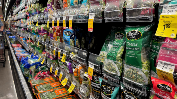 Grocery store shelves with Taylor Farms bagged greens