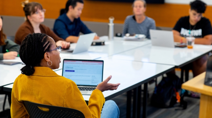 Students sitting around a seminar table.