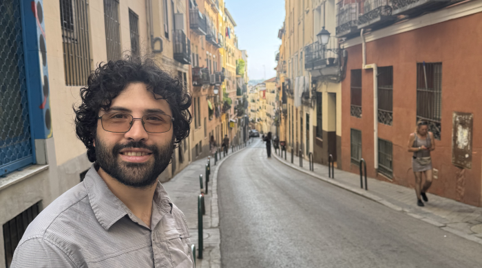 Photo of Andrés with a city street in Madrid in the background