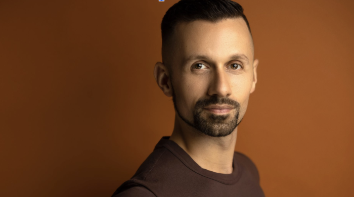 Headshot of Professor Justin Moniz
