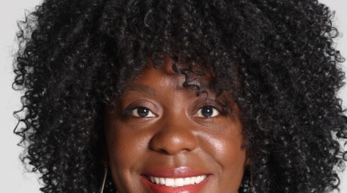 Headshot of Chantal Hailey smiling against a light gray background.