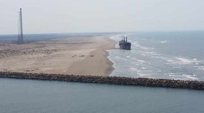 A cargo ship is seen making ground on a beach
