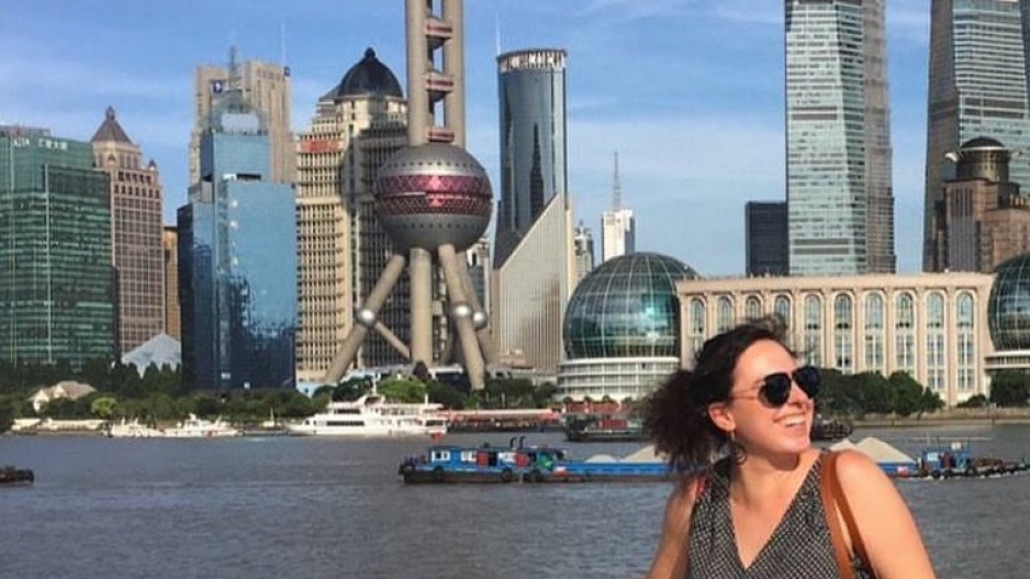 Alexa Ball standing in front of the skyline in China