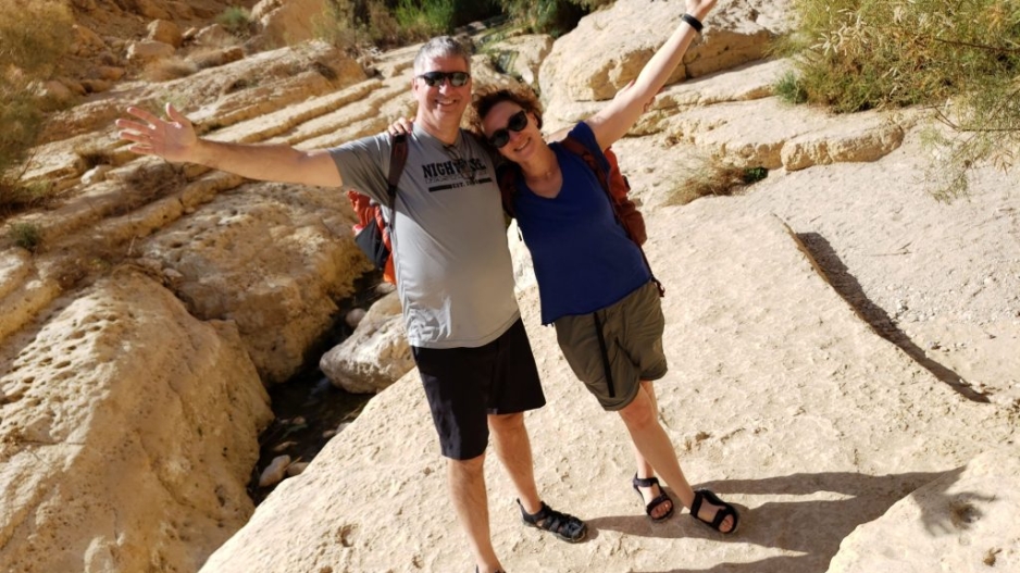 Yael Goverover and Gerry Voelbel posing in the desert in Israel.