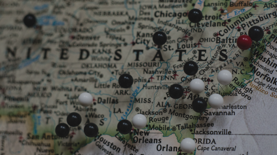 Push pins on a map of the United States