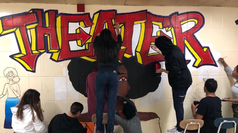 Students working on mural