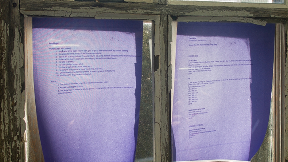 Colored pieces of paper with text on window.