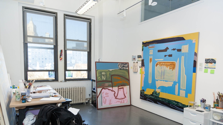 View of MFA studio with paintings. 