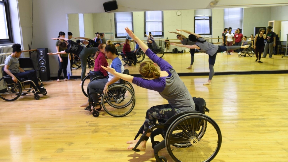 Students participate in a workshop using wheelchairs.