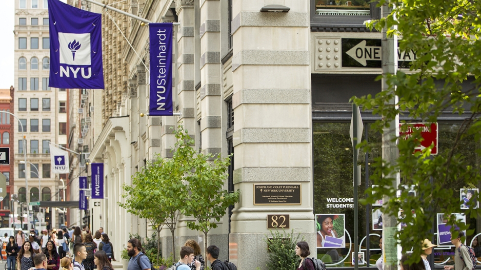 Street view of Pless Hall with NYU flag flying