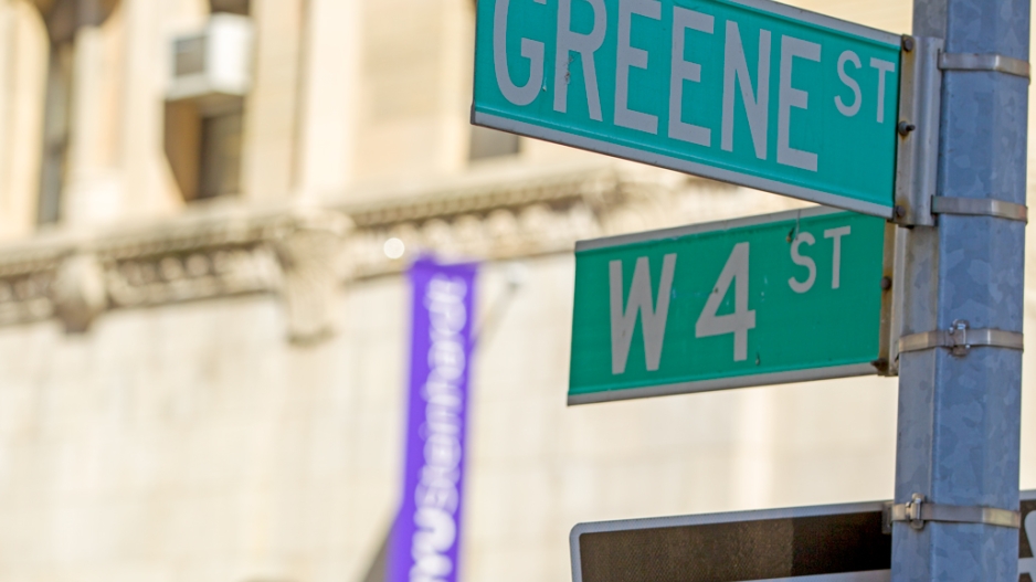 Street signs at the corner of Greene Street and West 4th Street