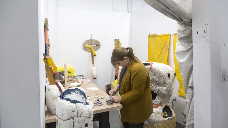 Photo of student working in studio space.