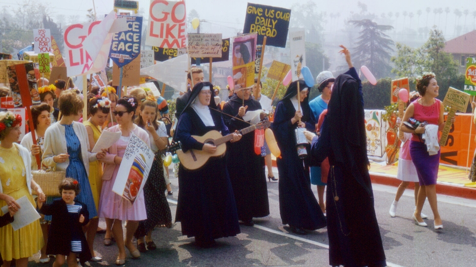 Scene from the movie "Rebel Hearts" showing nuns leading a group of protestors in the 1960s.