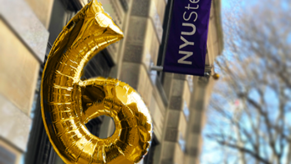 Gold #6 balloon in front of NYU Steinhardt flag and building
