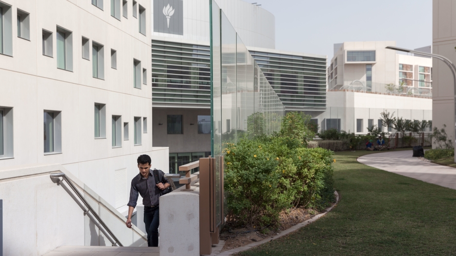 Student walking at NYU Abu Dhabi