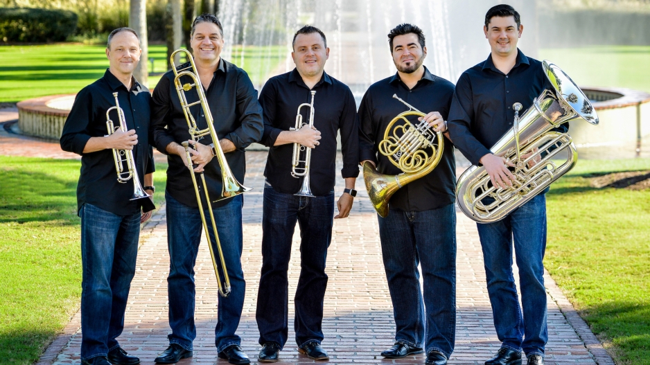 The 5 members of the Boston Brass in front of a fountain