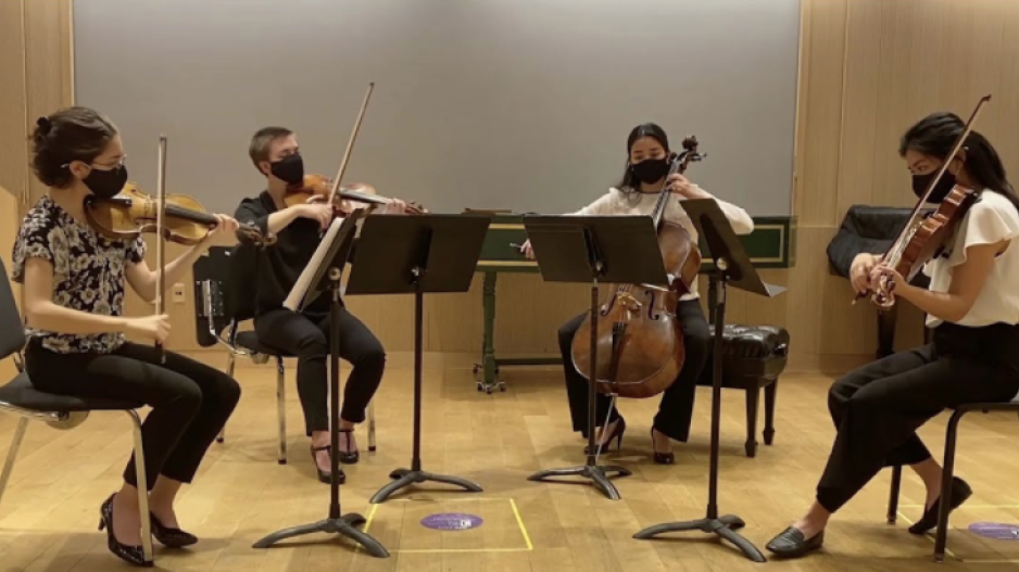 A string quartet performing remotely