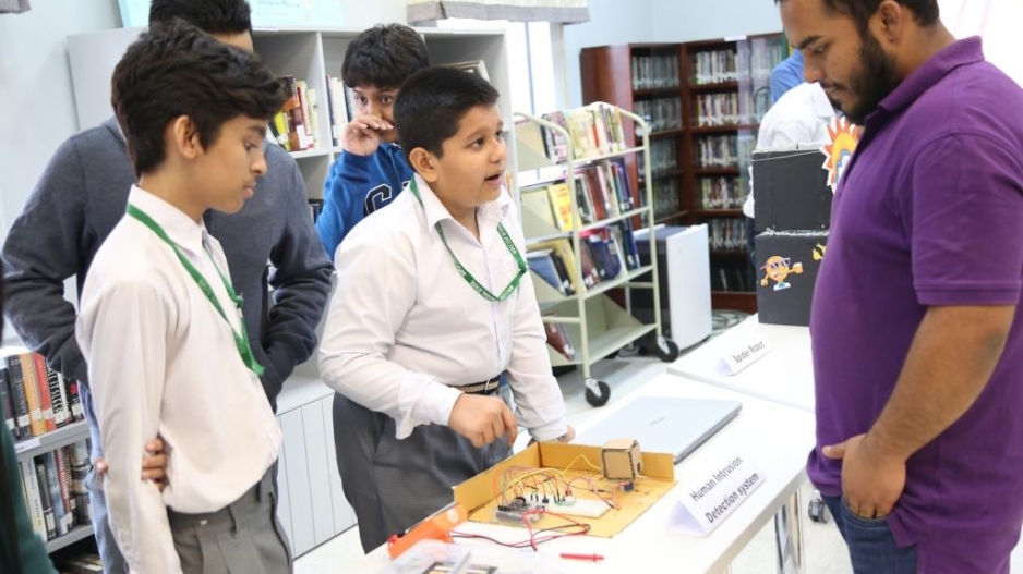 Students presenting computer science project