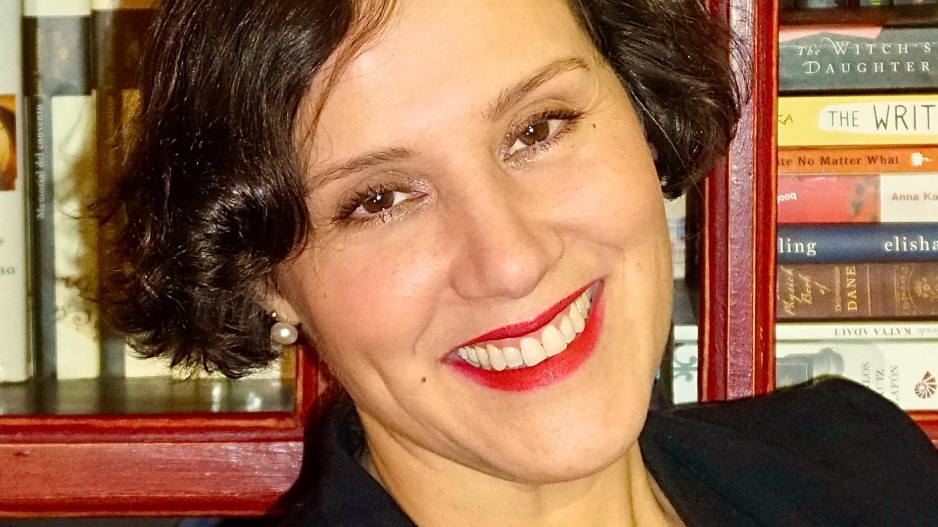 A headshot of Dr. Gigliana Melzi in front of a bookcase