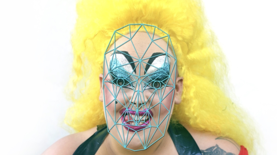Model using drag makeup techniques to confound facial recognition algorithms.