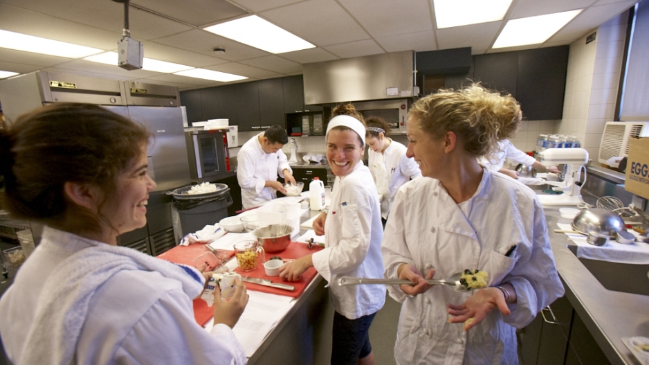 NYU students working in a kitchen to prepare food as part of their Experiential Learning