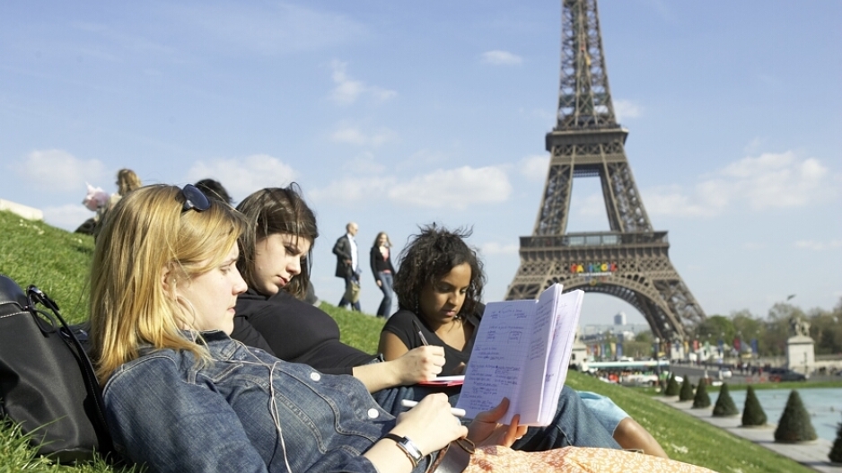 Students studying near the  Eiffel Tower