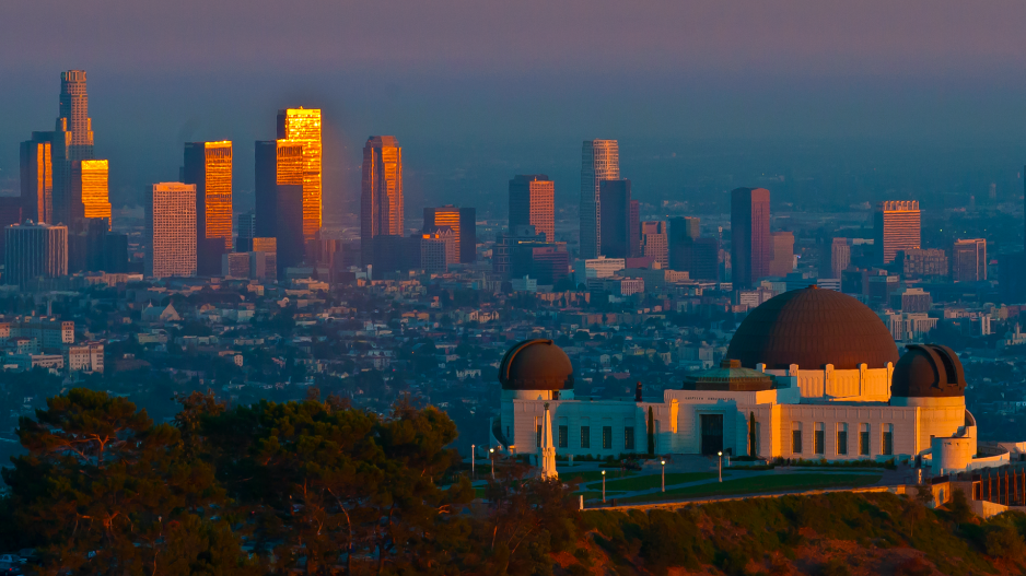 An aerial view of Griffith Observatory and Downtown LA at sunset.
