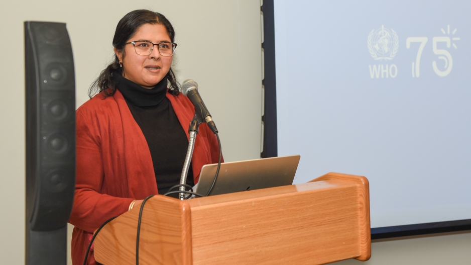 Nisha Sajnani speaks at a podium at the launch of the Jameel Arts & Health Lab.