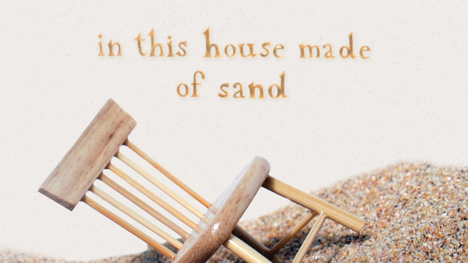 A wooden chair appears on a hill of sand - it's sinking