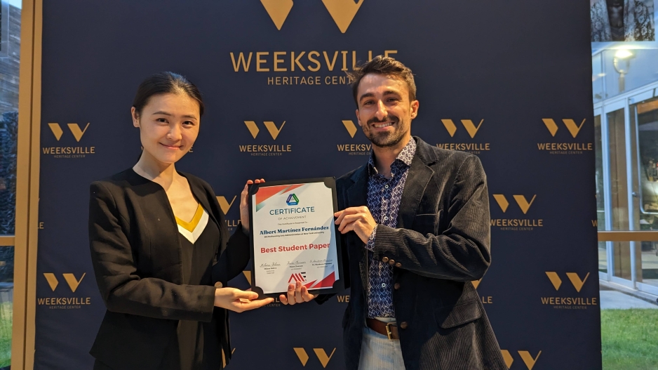Albert Martínez (‘23) receives the Best Student Paper award at the Closing Reception. From left to right: Dr. Youyou (Ruby) Yu and Albert Martínez.