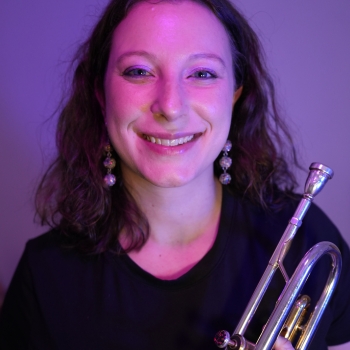 Kate holding a trumpet