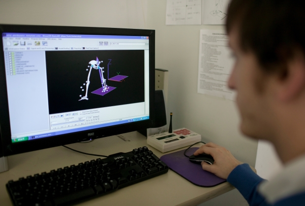 Physical therapy student studies a 3D model
