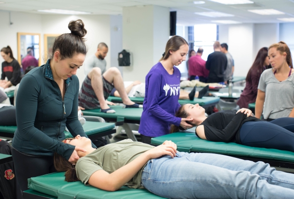 Physical therapy students attend a class lecture