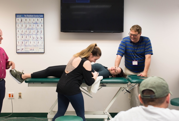 Faculty and students in a physical therapy class