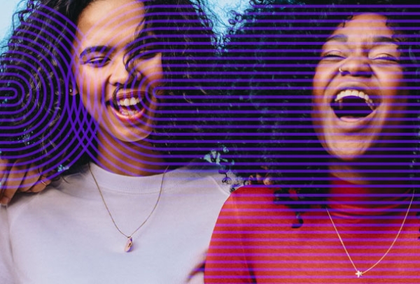 women of color with natural hair textures laughing