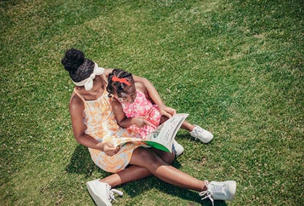 Mother & child reading outdoor