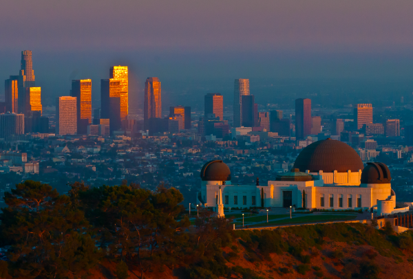 An aerial view of Griffith Observatory and Downtown LA at sunset.