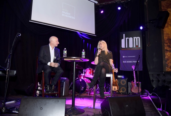 Larry Miller and guest Natalia Nastaskin sit together on stage at an NYU Steinhardt Music Business event
