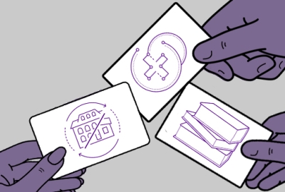 three hands holding cards with images for housing, health and education