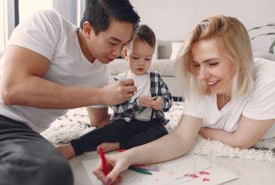 Parents coloring with their young child
