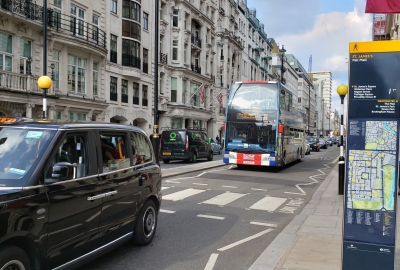 A busy one-way road filled with cars on the busy streets of London's St.James Neighborhood