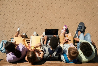 Aerial view of students sitting on a bench
