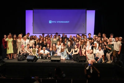 NYU Songwriting summer program posed on stage for group photo